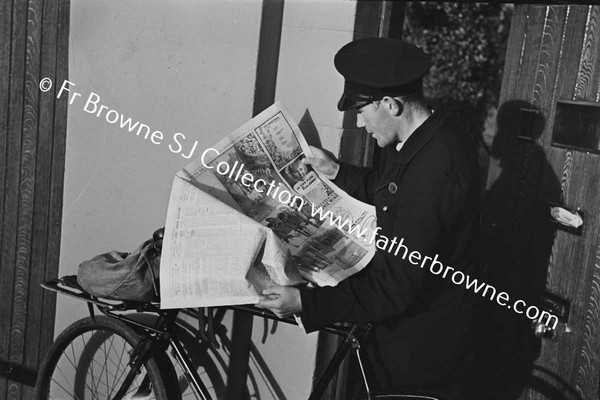 POSTMAN READING NEWSPAPER, IRISH IDEPENDENT